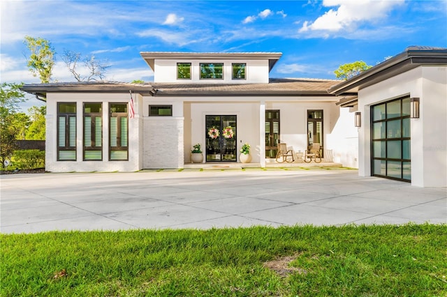 exterior space featuring a tiled roof and stucco siding