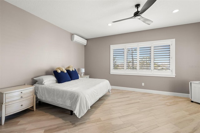 15904 Redington Dr, Redington Beach, FL 33708 - bedroom with recessed lighting, light wood-style flooring, baseboards, and a wall mounted AC
