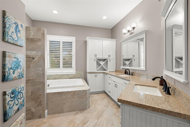15904 Redington Dr, Redington Beach, FL 33708 - bathroom with recessed lighting, a garden tub, and vanity