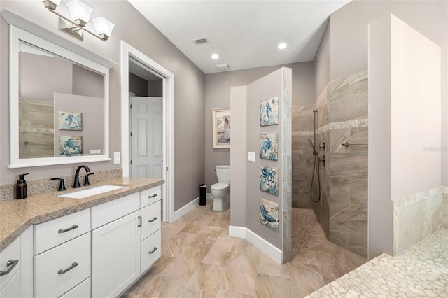 15904 Redington Dr, Redington Beach, FL 33708 - full bathroom featuring toilet, walk in shower, vanity, and baseboards