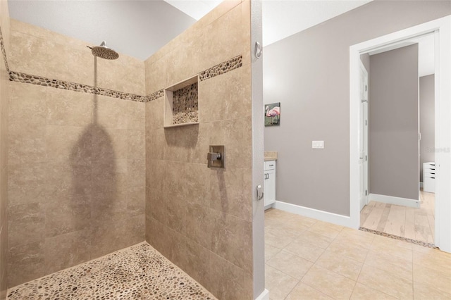 15904 Redington Dr, Redington Beach, FL 33708 - bathroom with tile patterned flooring, a tile shower, and baseboards