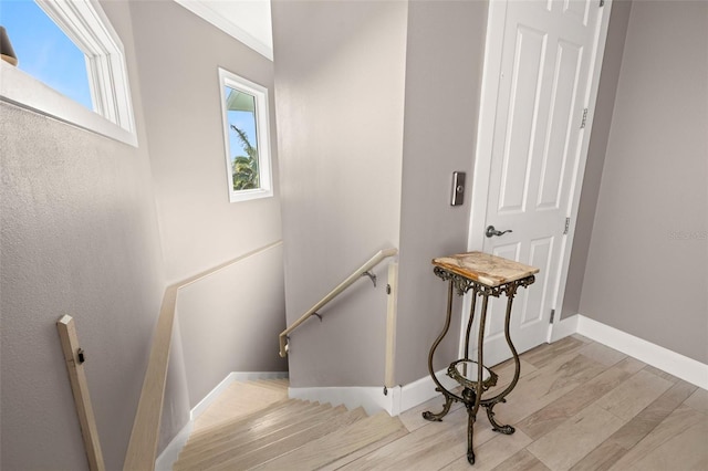 15904 Redington Dr, Redington Beach, FL 33708 - staircase featuring wood finished floors and baseboards