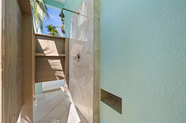 15904 Redington Dr, Redington Beach, FL 33708 - full bath featuring a textured wall, walk in shower, and tile patterned floors