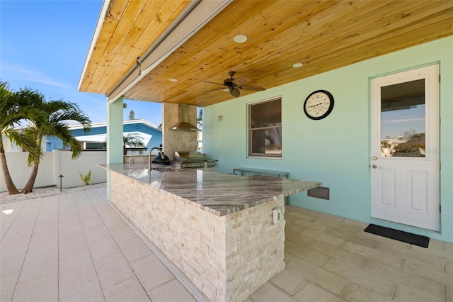 15904 Redington Dr, Redington Beach, FL 33708 - view of patio / terrace with an outdoor kitchen, a ceiling fan, a sink, fence, and outdoor wet bar