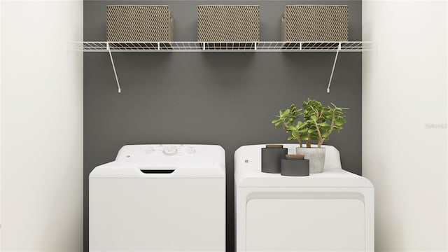 clothes washing area with laundry area and separate washer and dryer