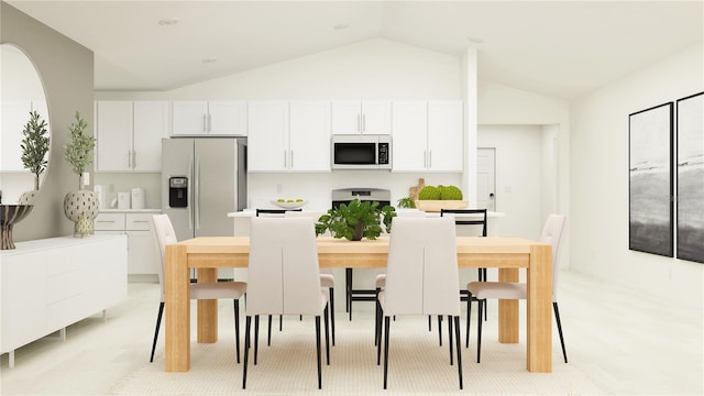 kitchen featuring vaulted ceiling, fridge with ice dispenser, white cabinets, and range