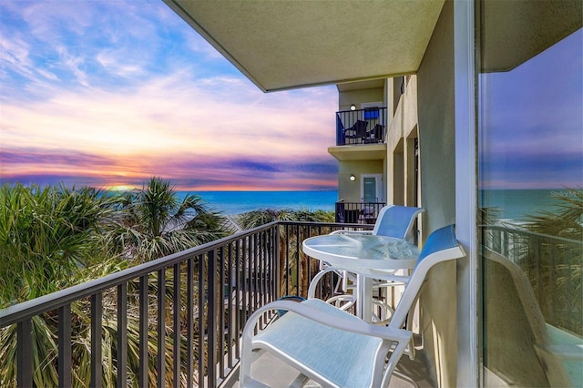 balcony featuring a water view