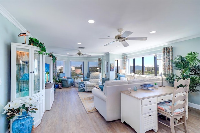 living room featuring a ceiling fan, visible vents, light wood-style flooring, recessed lighting, and ornamental molding