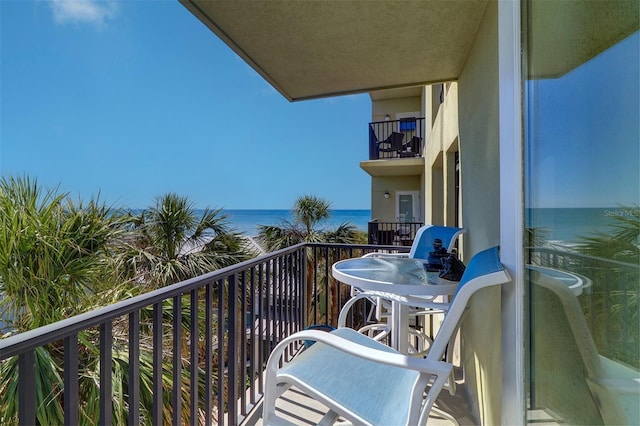 balcony featuring a water view