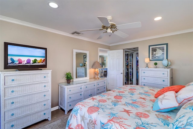 bedroom with visible vents, ornamental molding, recessed lighting, a closet, and dark wood-style flooring