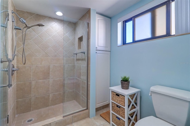 full bathroom featuring tile patterned floors, toilet, recessed lighting, and a stall shower