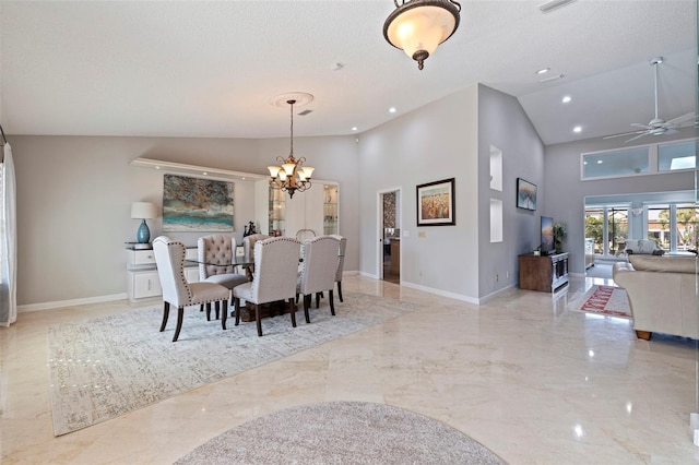 dining room with marble finish floor, baseboards, and a textured ceiling