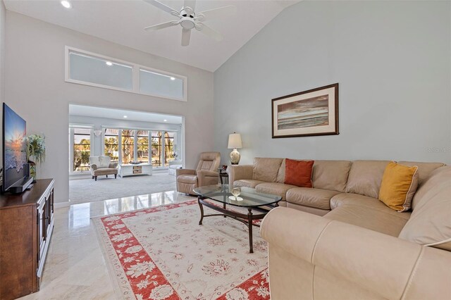 living room featuring baseboards, high vaulted ceiling, a ceiling fan, and recessed lighting