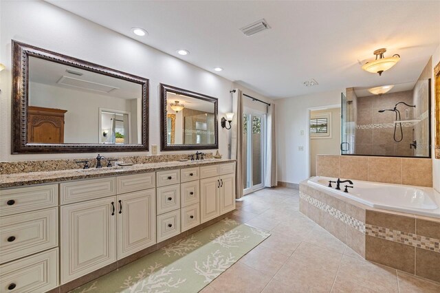 bathroom with a garden tub, a shower stall, visible vents, and tile patterned floors