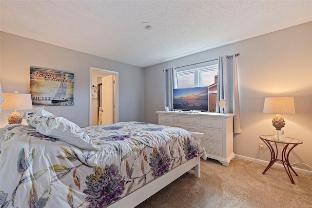 bedroom with light carpet, a textured ceiling, and baseboards