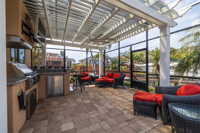 view of patio / terrace featuring a lanai, a grill, an outdoor living space, exterior kitchen, and a pergola