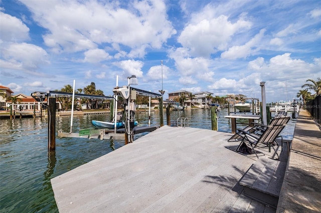 view of dock featuring a water view and boat lift