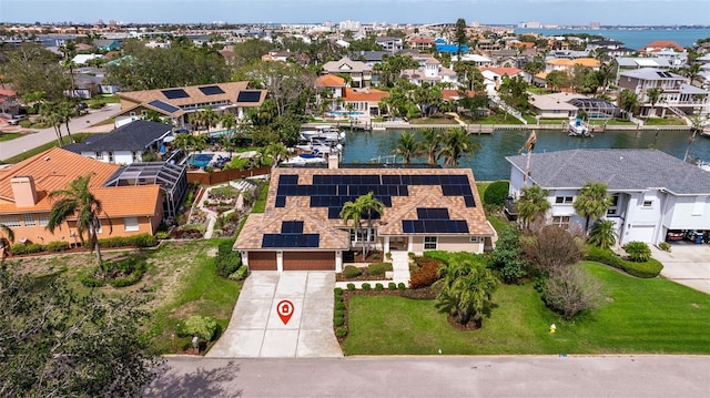 bird's eye view with a water view and a residential view