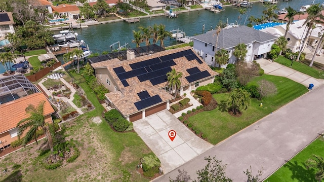 birds eye view of property featuring a water view and a residential view