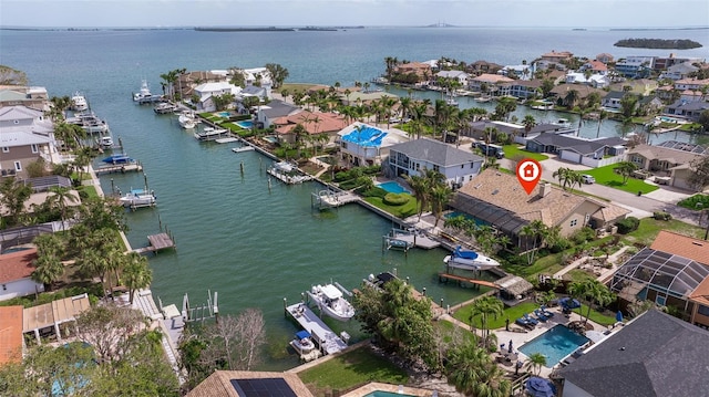 birds eye view of property with a residential view and a water view