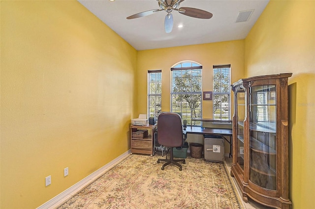 home office with visible vents, baseboards, and ceiling fan