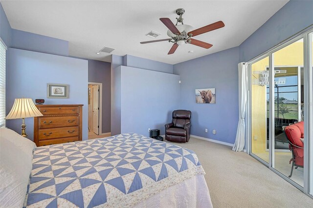 carpeted bedroom featuring visible vents, multiple windows, baseboards, and access to outside