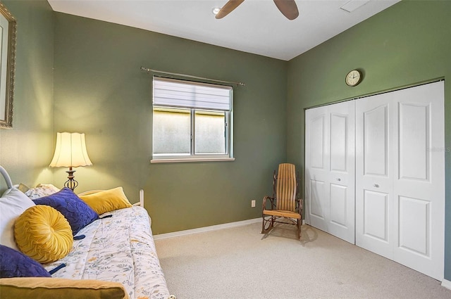 sitting room with baseboards, carpet, and ceiling fan