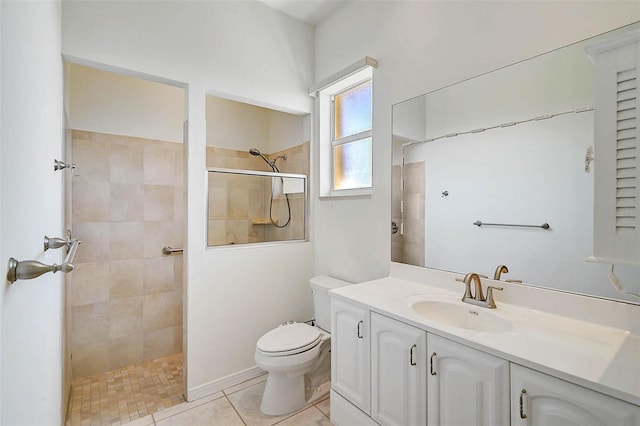 full bath featuring tile patterned floors, a walk in shower, toilet, and vanity