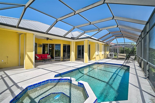 view of pool featuring a ceiling fan, a pool with connected hot tub, an outdoor living space, a patio, and a lanai