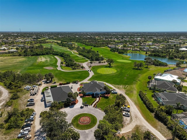 bird's eye view with a water view and view of golf course