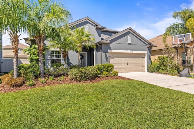 view of front of property featuring an attached garage, concrete driveway, a front yard, and stucco siding