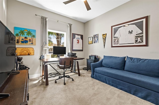 office area with carpet floors, ceiling fan, and baseboards