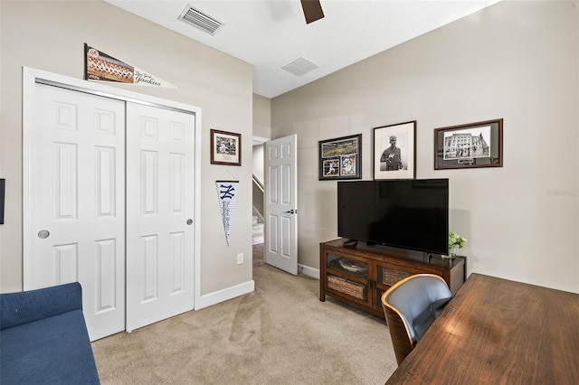 office space with carpet, visible vents, ceiling fan, and baseboards