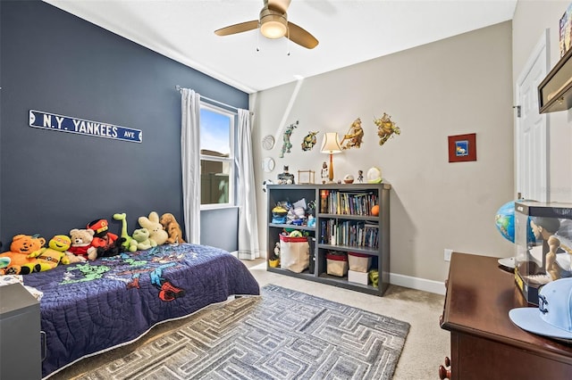 bedroom featuring carpet, baseboards, and a ceiling fan