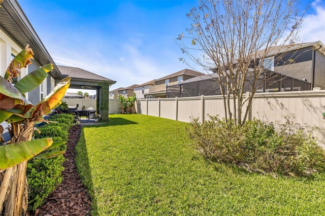 view of yard featuring a patio area and a fenced backyard