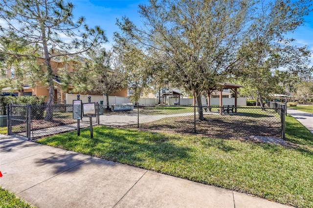 exterior space featuring fence and a yard