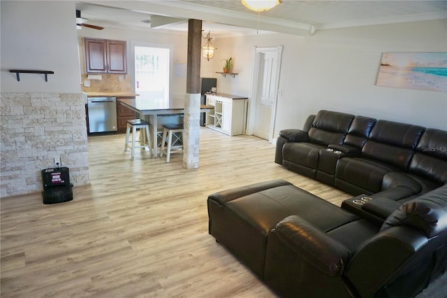 living room with light wood-style floors, ceiling fan, and crown molding