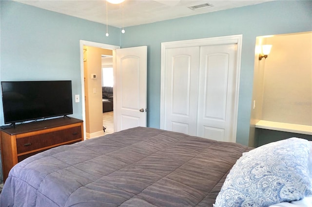 bedroom featuring a closet and visible vents