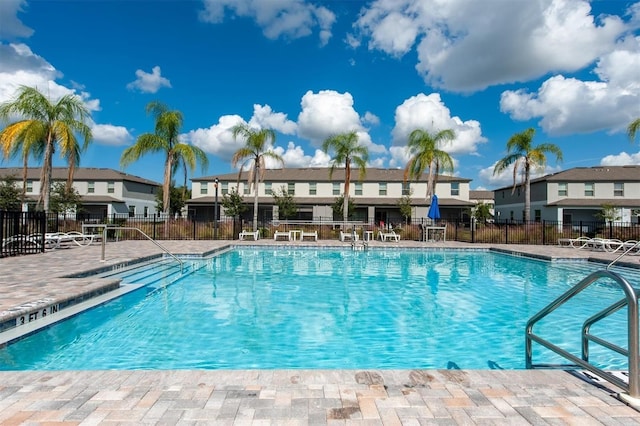 pool featuring a patio and fence