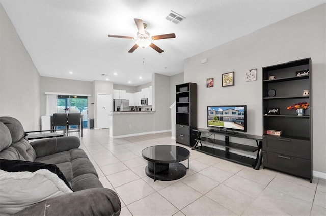 living area with visible vents, baseboards, ceiling fan, light tile patterned flooring, and recessed lighting