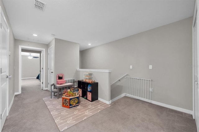 interior space featuring carpet, visible vents, and baseboards