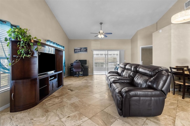 living area with visible vents, high vaulted ceiling, a wealth of natural light, and a ceiling fan