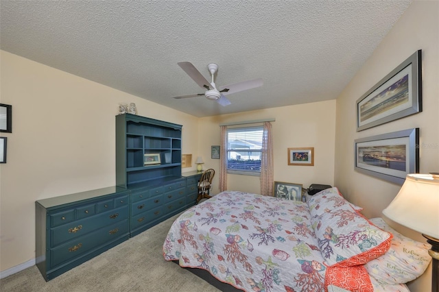 bedroom with carpet flooring, a textured ceiling, and ceiling fan