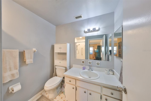 bathroom with visible vents, toilet, walk in shower, and vanity