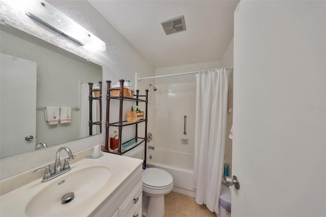 bathroom featuring vanity, shower / bathtub combination with curtain, visible vents, tile patterned floors, and toilet