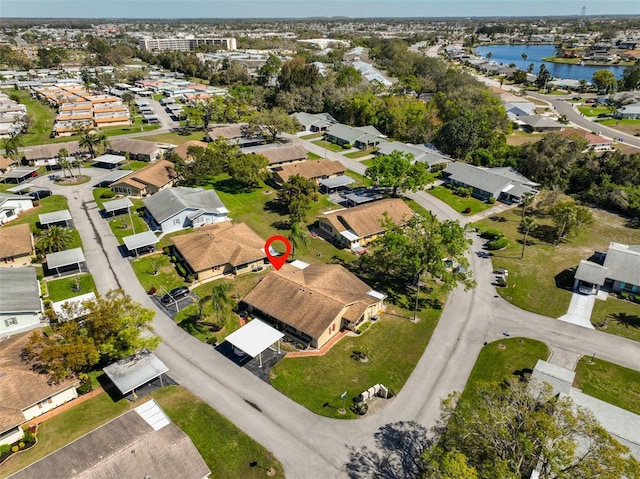 bird's eye view with a residential view and a water view