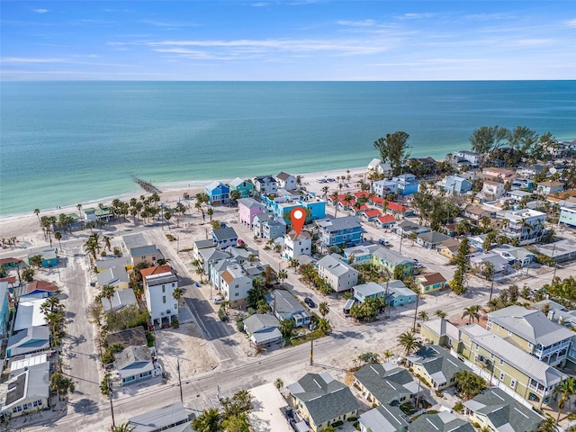 aerial view with a water view and a view of the beach