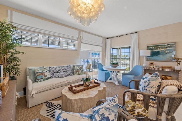 carpeted living area with a notable chandelier