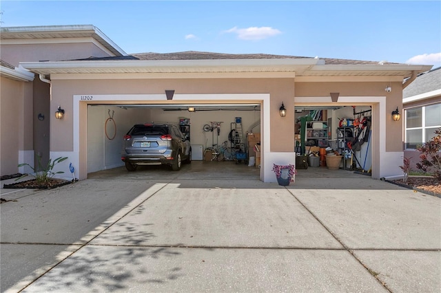 garage with concrete driveway