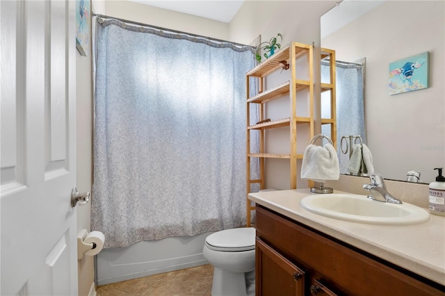 bathroom with tile patterned flooring, shower / tub combo with curtain, vanity, and toilet